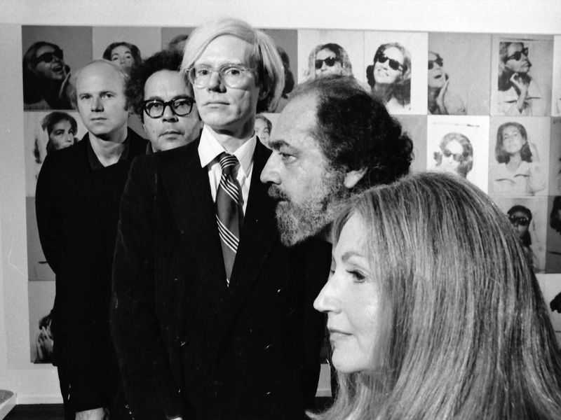 Andy Warhol photographed with art collectors Ethel and Robert Scull, sculptor George Segal, and painter James Rosenquist at the Scull's residence in 1973. (Photo by Jack Mitchell/Getty Images)